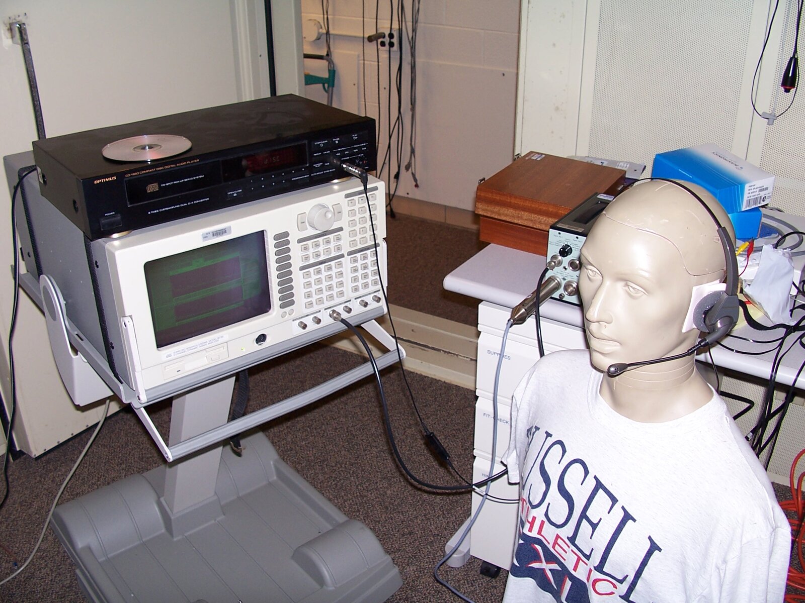Call center operator headset on a test fixture — representing the customer support functions that chatbots increasingly handle